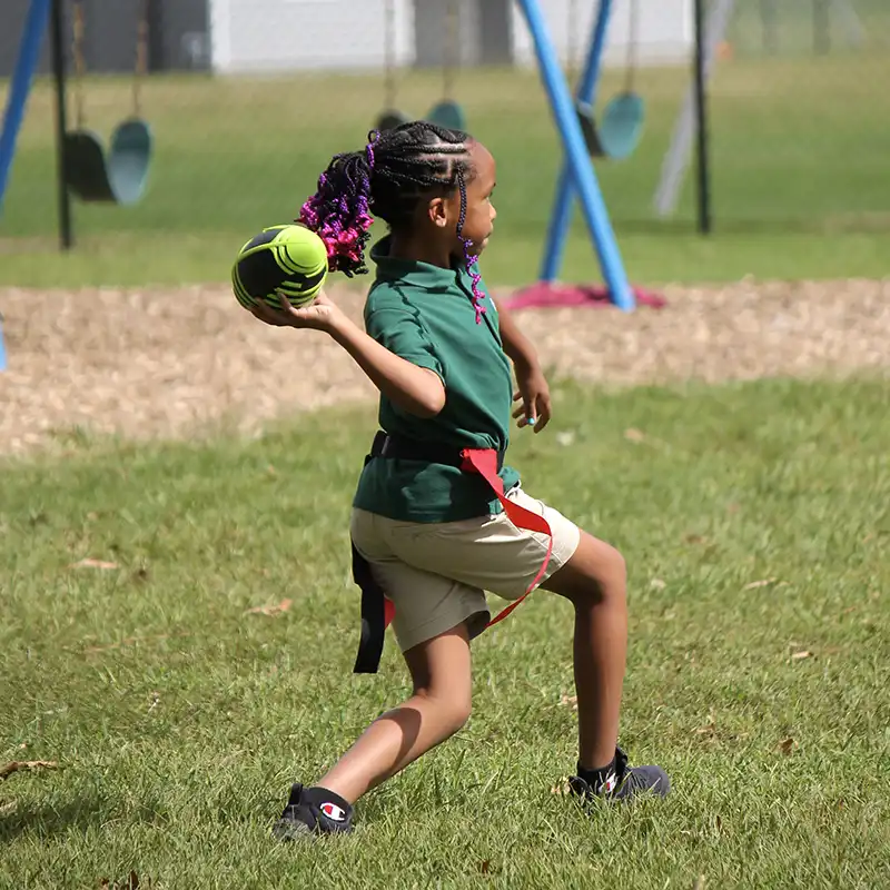 Gateway Christian Academy - Physical Education PE - - girl playing flag football